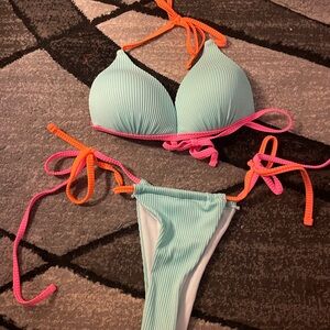 Blue bathing suit with pink and orange ties